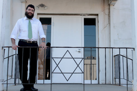 Rabbi Schneur Wilhelm outside the Joyce and Sol Happiness Hall at Woodmont-Chabad