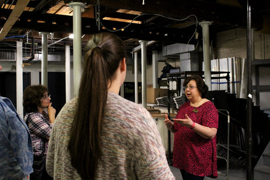 Kathy Apuzzo leading a tour at the Shubert Theater in New Haven, CT