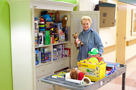 Diane Petra next to a Toy Closet