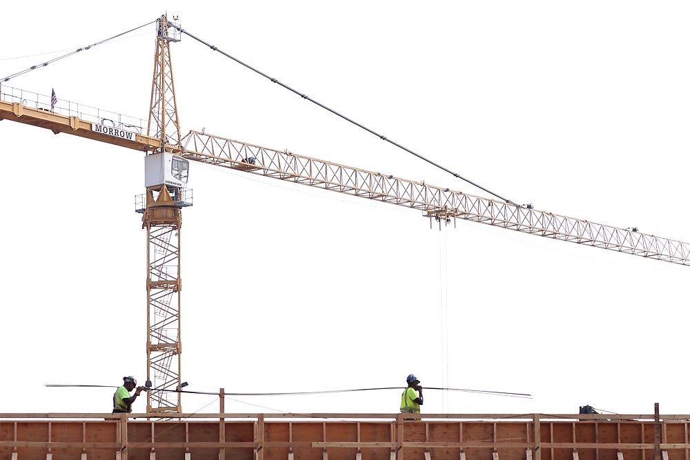 Workers at the site of Yale’s new residential colleges